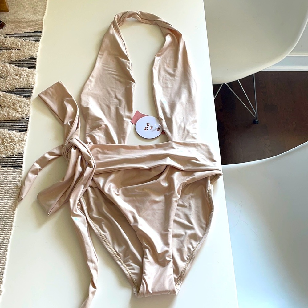 PQ one piece swim in color shell. Size M. NWT